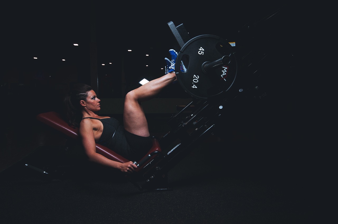 A woman performing the leg press exercise